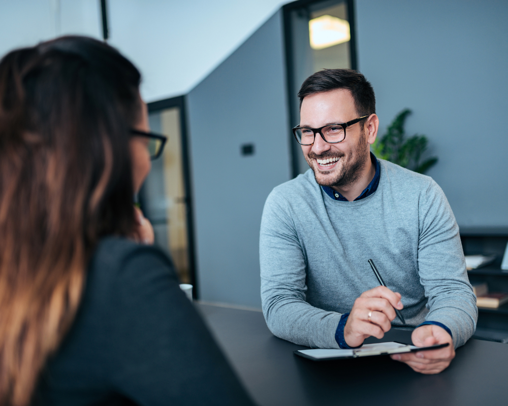 A man talking with a girl in the office