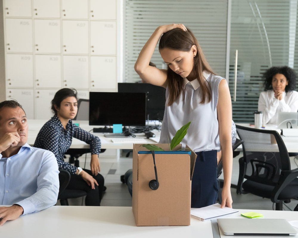 People looking at an employee in the office